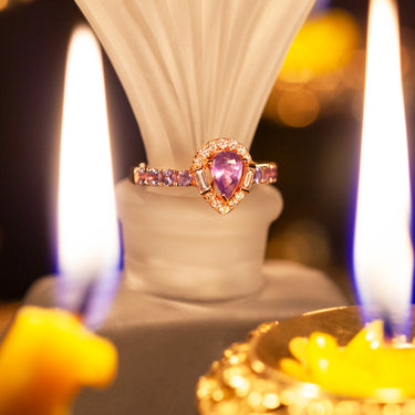 0.52ct natural pear-shaped alexandrite ring in 18k rose gold with diamond halo and accent stones